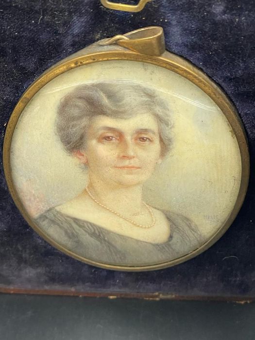 A miniature portrait, signed H M K dated 1931 of a lady in a black dress with a pearl necklace. - Image 2 of 4