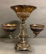 A Silver plate Epergne or centrepiece embossed design on north wind feet from The Bombay Company