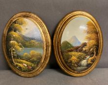 Two antique oil on wood oval paintings of river scene