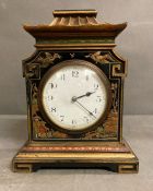 A black chinoiseries mantel clock with oriental theme