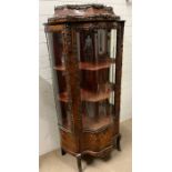 A Louis XVI style Bijouterie cabinet of display cabinet with serpentine glass front ormolu mounted