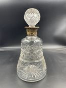 A hallmarked silver collared cut glass decanter (H 25 cm D 12cm at base)