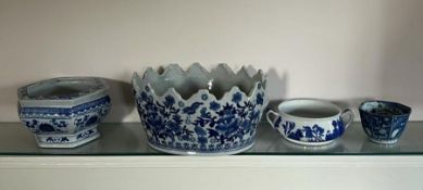 Four blue and white oriental china bowls