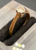 A diamond solitaire ring, stone is 4mm in diameter, on an 18ct yellow gold and platinum setting (