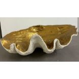 A giant faux clam shell inside gilded painted (H21cm W65cm D38cm)