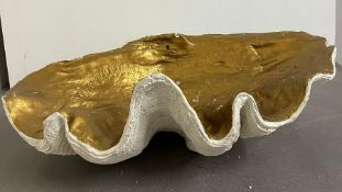 A giant faux clam shell inside gilded painted (H21cm W65cm D38cm)