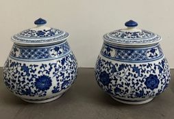 A pair of blue and white Chinese lidded jars