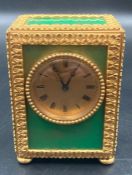 A French Hour Lavigne travel alarm clock with green panels