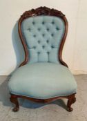 A mahogany spoon back slipper chair with carved floral details