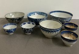 A selection of blue and white bowls, various ages and patterns