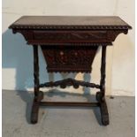 An antique hand carved Burmese desk/writing table