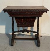 An antique hand carved Burmese desk/writing table