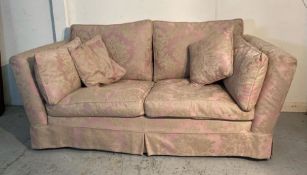 A Duresta two seater sofa, upholstered with a pink and gold floral pattern