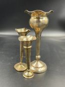 Three assorted hallmarked silver engraved vases with weighted bases