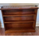 A carved open bookcase with galleried top (133cm x 24cm x 110cm)