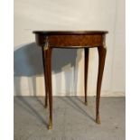 A continental parquetry occasional table on cabriole legs with gilt banding and Floyd motifs (