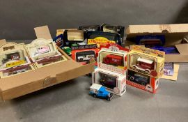 A box containing a selection of diecast vehicles.