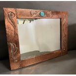 A Liberty copper Art Nouveau copper mirror by Archibald Knox with inset Ruskin 75 cm x 56cm)