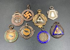 A selection of Vintage motorcycle competition medals, some silver.