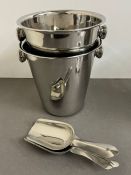 A pair of metal wine/ice buckets with scoops