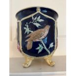 A majolica footed planter , decorative with birds