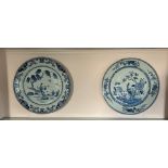 Two blue and white large oriental plates painted to the centre with river scenes and birds of