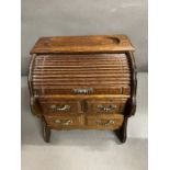 A Jewellery box in the form of a fall front desk.