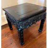 An 19th century carved Chinese table, possibly Qing dynasty (H35cm Sq37cm)