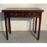 An antique mahogany games table with carved floral detail to sides, brass drop down handles (H73cm
