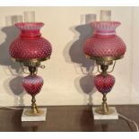 A pair of Fenton cranberry Opalescent Hobnail table lamps AF