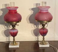 A pair of Fenton cranberry Opalescent Hobnail table lamps AF