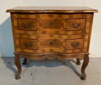 A two drawer serpentine fronted chest (H67cm W71cm D37cm)