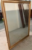 A wooden silver and gold framed wall mirror (142cm x 155cm)