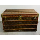 A monogram canvas Louis Vuitton steamer trunk with brass and oak mounts (H58cm W100cm D54cm) (No