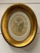 A framed miniature portrait of a girl on silk
