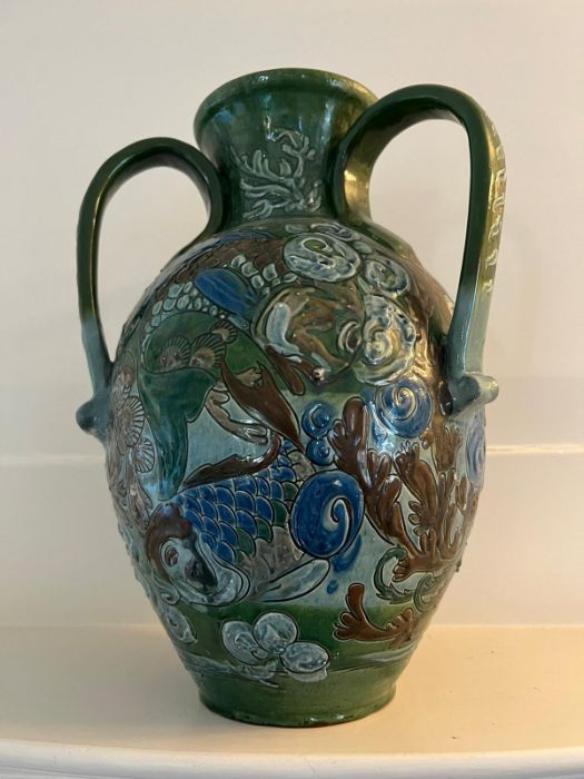A CH Brannam art pottery three handled vase. An earthenware vase decorated in relief design. the - Image 7 of 7