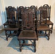 A selection of eight oak Victorian dining chairs with leaf carved central splats and barley twist