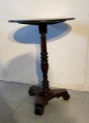 A dark oak turned pedestal table (H74cm D51cm)