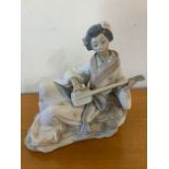 A Geisha playing a Shamisen by Nao