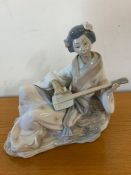 A Geisha playing a Shamisen by Nao
