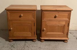 A pair of pine bedside tables