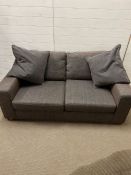 A grey two seater Marks and Spencers sofa (H69cm W173cm D90cm)