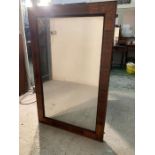 A mahogany inlaid wall mirror