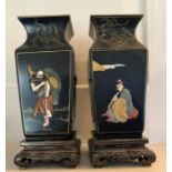 A pair of Chinese ebonised vases, pearlized tops depicting the eight fairies festival