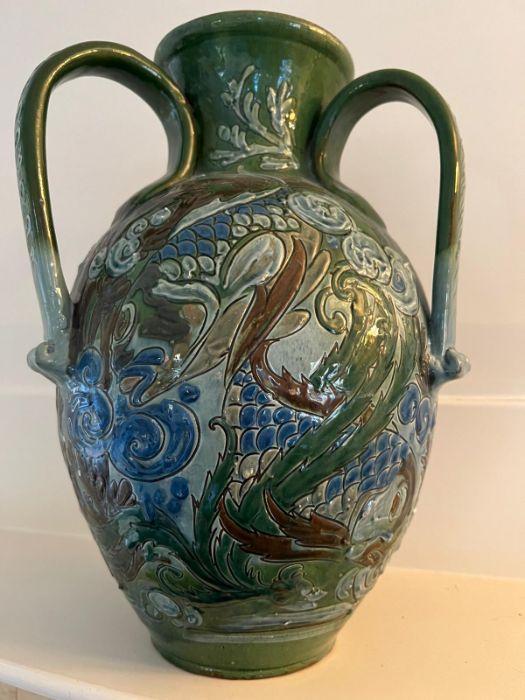 A CH Brannam art pottery three handled vase. An earthenware vase decorated in relief design. the - Image 6 of 7