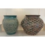 Two vases with a hammered design and shell