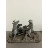 A sculpture of a hunting scene