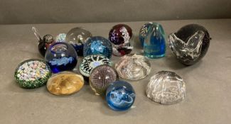 A selection of glass paperweights to include Caithness