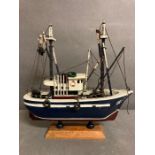 A wooden and model of a Trawler