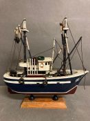 A wooden and model of a Trawler